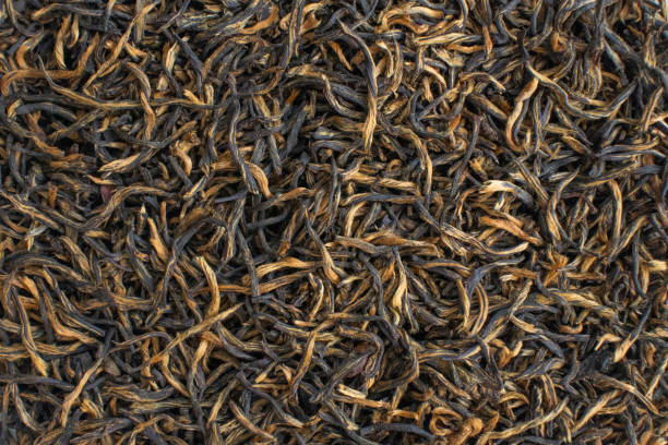istock Black red tea cha dried leaves chinese tea ceremony 1336507974