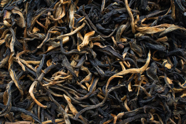 istock Black red tea cha dried leaves chinese tea ceremony 1336508054