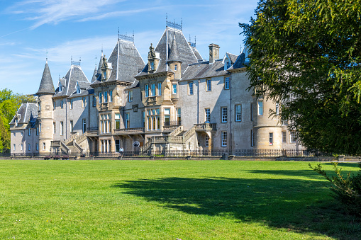 Falkirk, Scotland - May 12, 2019: View of the historic Callendar House, set in the landscaped expanse of Callendar Park, a public park in Falkirk. The history of the site goes back to the 14th century.