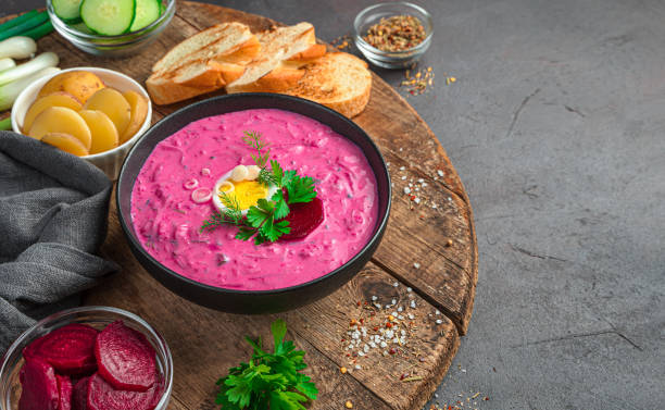 istock Cold beetroot soup with fresh herbs, egg, potatoes and kefir. A traditional Lithuanian dish 1336509264