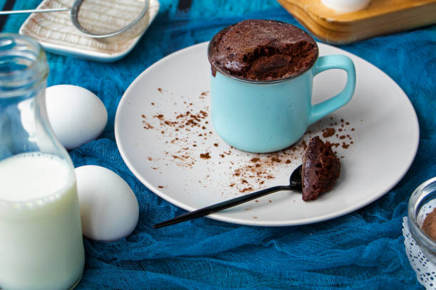 istock mugcake is microwaved. Homemade cupcake in a mug is on a plate. 1336510887