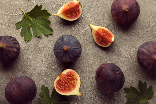 istock Fresh ripe figs on grey background. Tropical fruit 1336511431