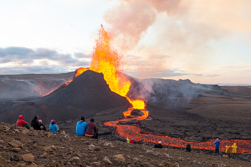 Geldingadalir, Iceland - May 11, 2021: A small volcanic eruption started at the Reykjanes peninsula. The event has attracted thousands of visitors who have braved a daring hike to the crater.