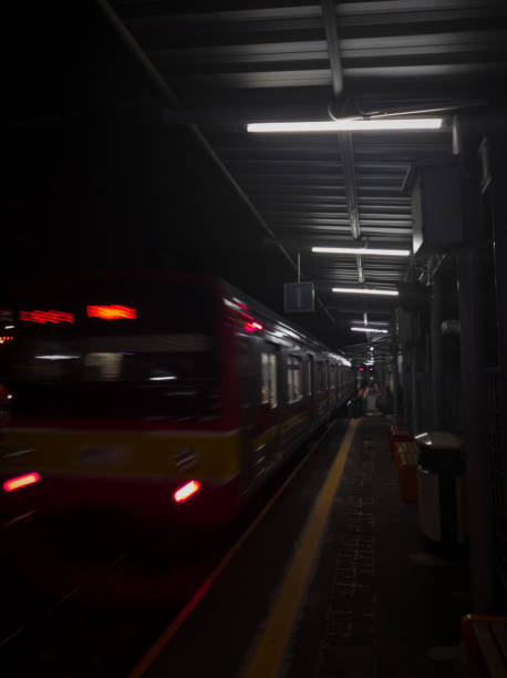 istock The train comes to pick up passengers at night. 1336513517