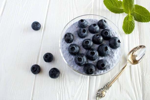 istock Pudding with chia seed  and  blueberry  on the white wooden background. Top view. 1336515142
