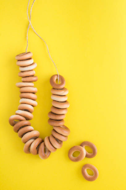 istock Bunch of bagels on the yellow background. Copy space. 1336515205