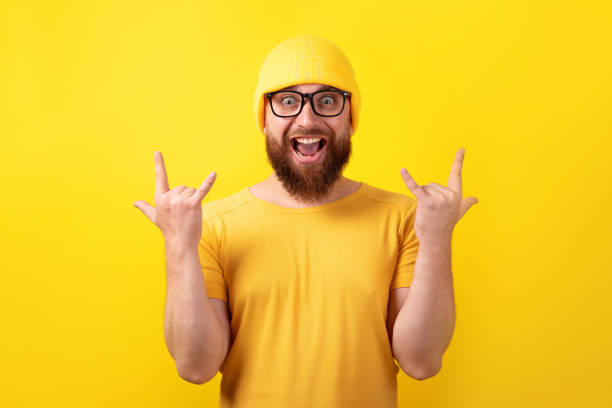 istock funny man makes rock n roll gesture 1336515415