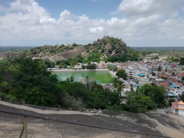 View of hills with pond under the sky