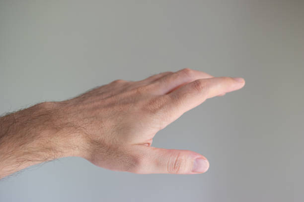 Mature woman hand meditating - dof on hand -, outdoors