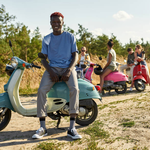 istock Happy young african american boy posing on scooter 1336518704