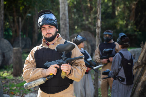 istock Man and his paintball sport team 1336519853