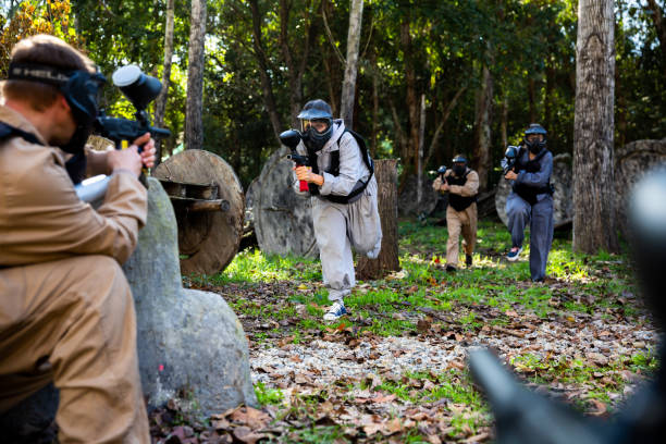 istock People playing paintball outdoors 1336519858