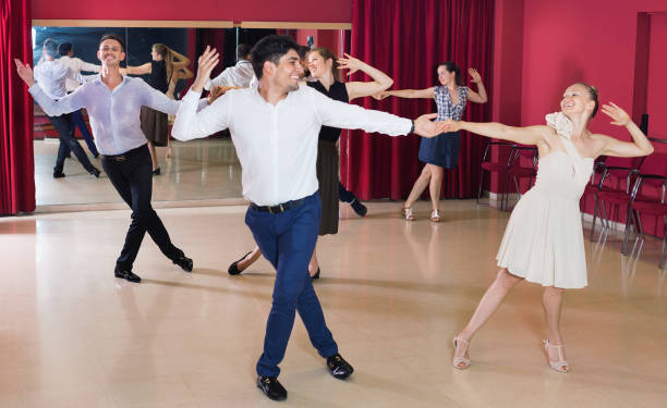 istock Young people dancing rock-and-roll in pairs 1336520828