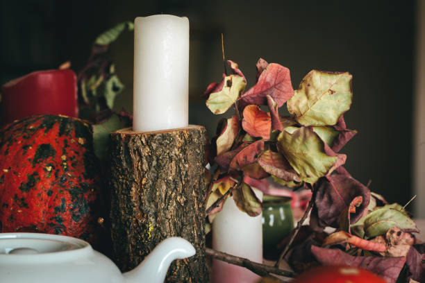 istock Autumn decor with pumpkin, candles and tableware 1336521065