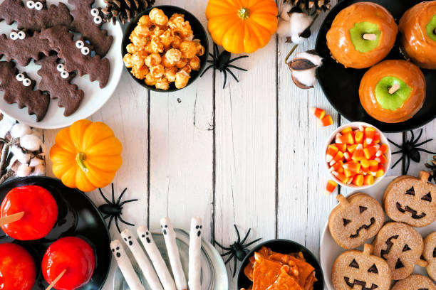 istock Classic Halloween treat frame over a white wood background 1336521129