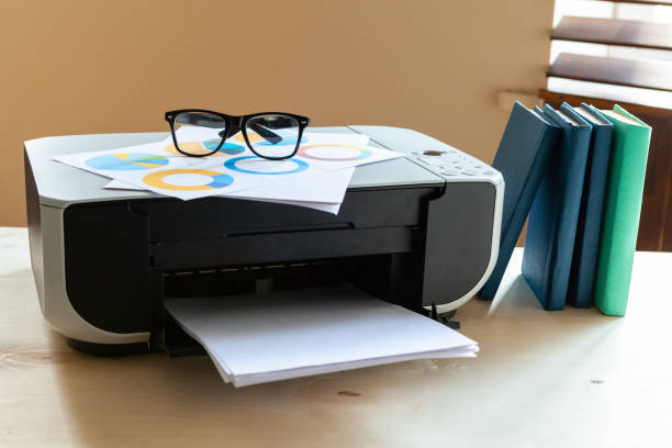 istock Close up of an office table with printer on it 1336521262