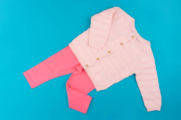 istock baby clothes on blue background top view 1336522617
