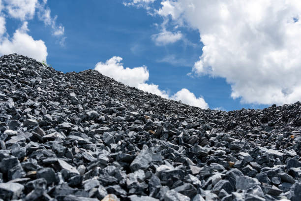 istock Gravel pile and cloudy sky. 1336523112