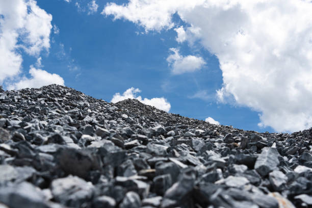 istock Gravel pile and cloudy sky. 1336523118