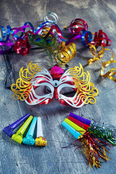 istock Carnival mask and blower on wood 1336524457
