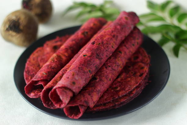 istock Beetroot Paratha is a Indian pan fried whole wheat flatbread made of wheat flour kneaded with fresh grated beetroot and spices. 1336525712