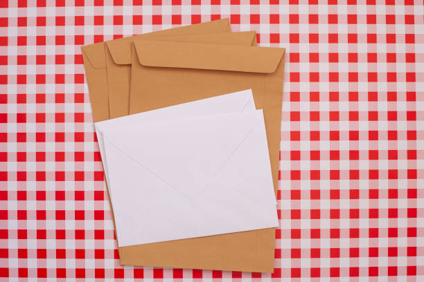 istock Set of envelopes with paper mockups on colored background. Blank paper envelope template. Vector template for business and brand identity. 1336525954