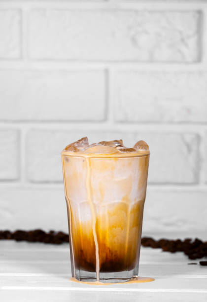 istock Iced Coffee with milk on white background, Summer refreshment drink, Coffe Bean 1336527324