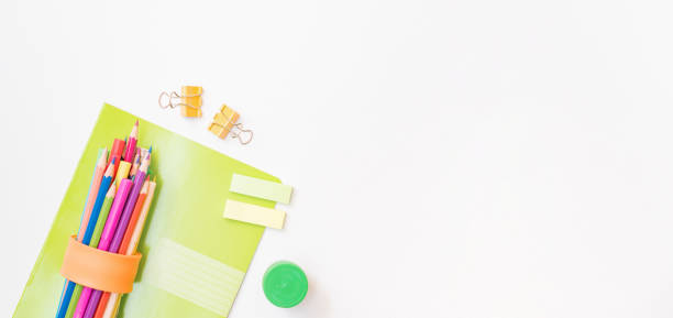 istock Flat lay frame with school and office supplies on a white background 1336529178