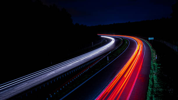 istock lights of cars with night. 1336534513