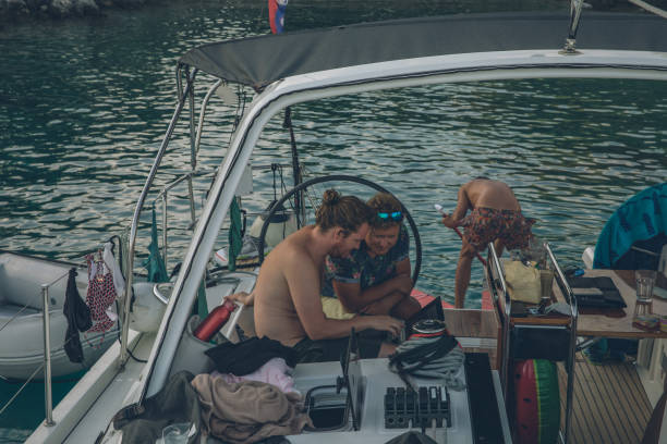 istock Young couple floating on a SUP and inflated ring 1336536490