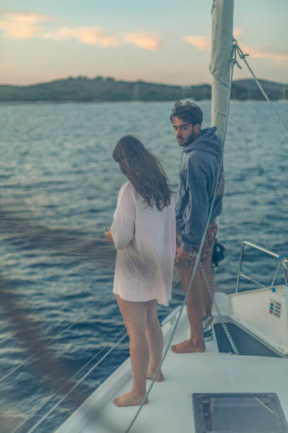 istock Young couple on sailboat at sea 1336537135