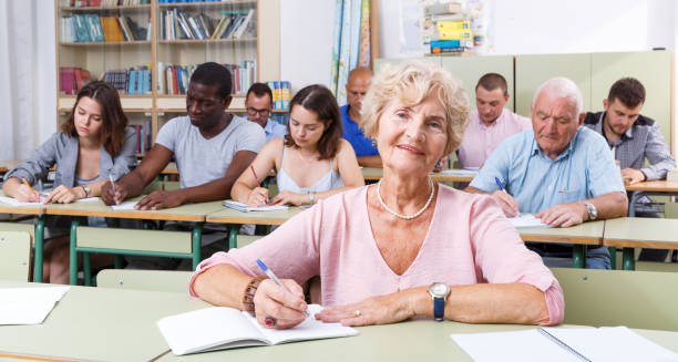 istock Mature woman take a written exam 1336540799