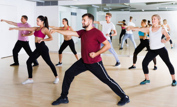 istock active men and ladies dancing aerobics at lesson 1336540823