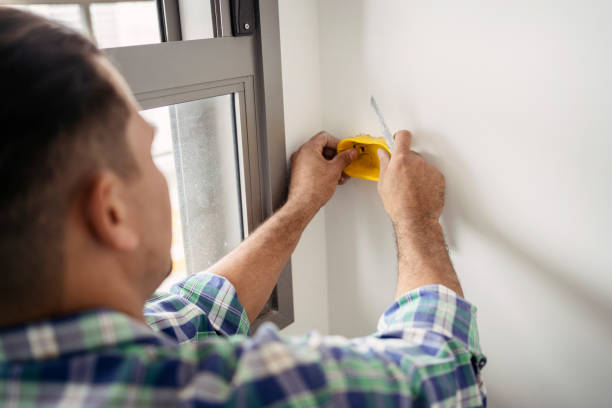 istock Electrician marking drywall for clipping 1336542621