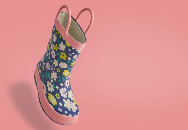 isolated kids toddler rain rubber boot on a pink background 3d view angle