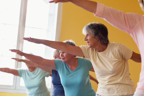 istock Yoga class with senior adults: the warrior position 1336546692