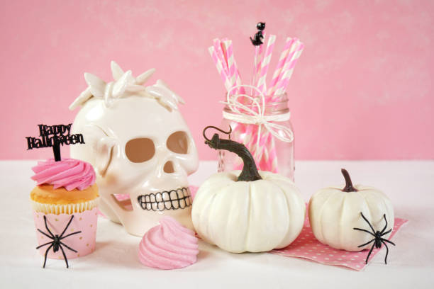 istock On trend pink Halloween party table with cupcakes 1336547591