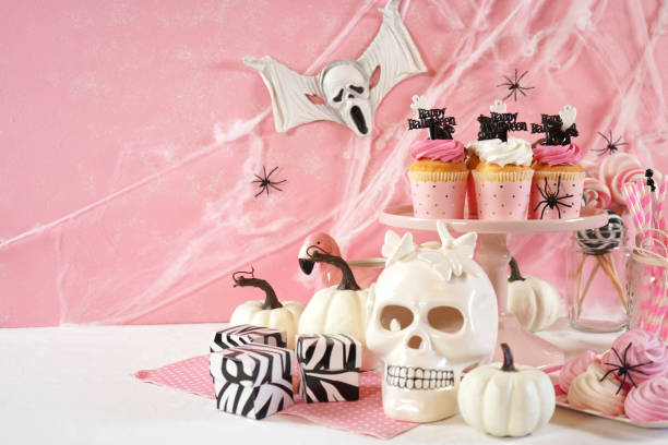 istock On trend pink Halloween party table with cupcakes 1336547711
