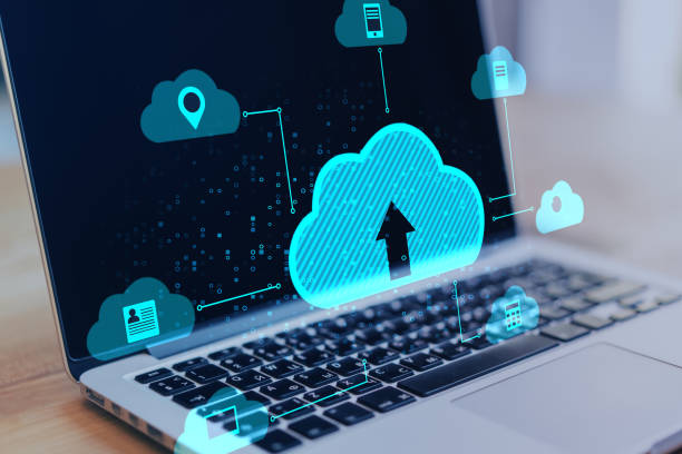 istock Close up of notebook at desktop with abstract digital cloud on blurry background. Cloud computing, database and technology concept. 1336548786