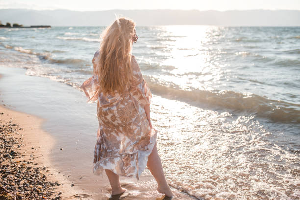 istock Plus size model woman enjoying the sun and sea 1336548830