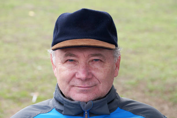 istock old man in cap smiling portrait close-up 1336550122