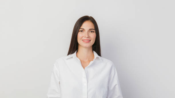 istock A young woman portrait isolated against a solid white background 1336550725