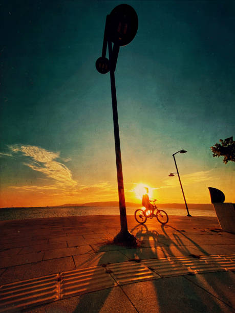 istock Cyclist on the beach at sunset. 1336551263