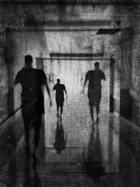 istock Multiple exposure monochrome view of a man walking in the building. 1336551307