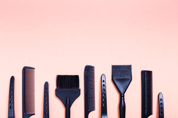 istock Combs and bleach brushes on pastel colored paper 1336551986
