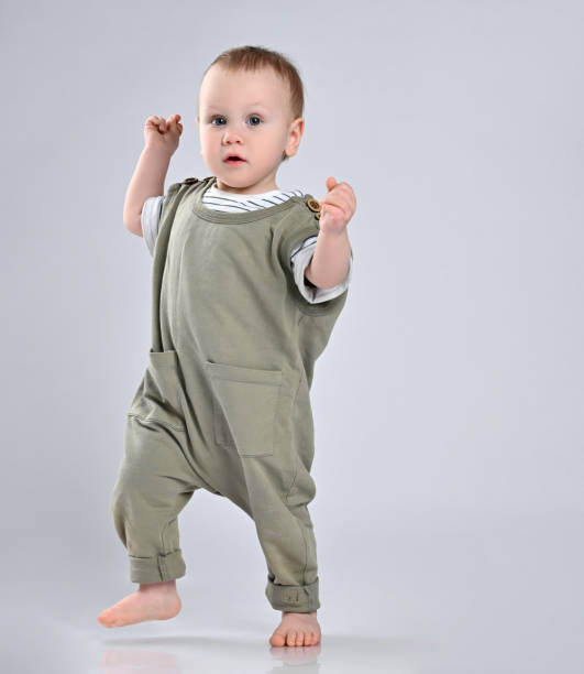 istock First steps of baby isolated on white background 1336552005
