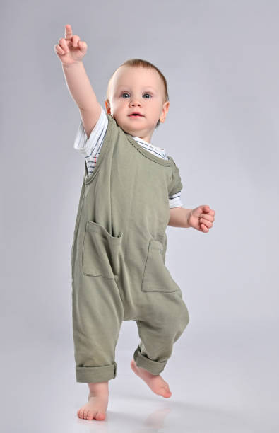istock First steps of baby isolated on white background 1336552212