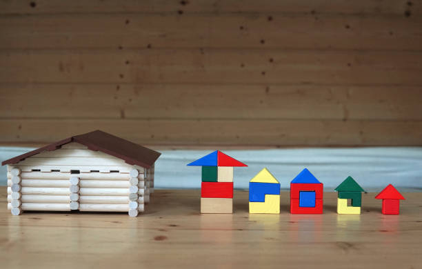 istock different house made of cubes and logs concept construction 1336555527