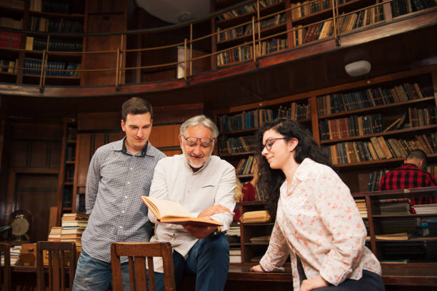 istock Group of students studying together at the University library 1336555578