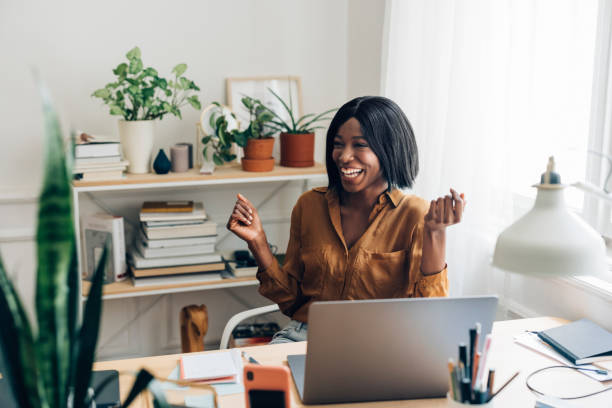 istock Happy Business Woman Working from Home on Laptop Computer 1336556415